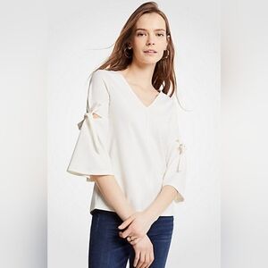 #1442 Ann Taylor Petites cream colored bell sleeve with bow sz MP